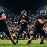 Cowboys vs Steelers Sunday Night Football preview NFL quarterback in pocket under stadium lights